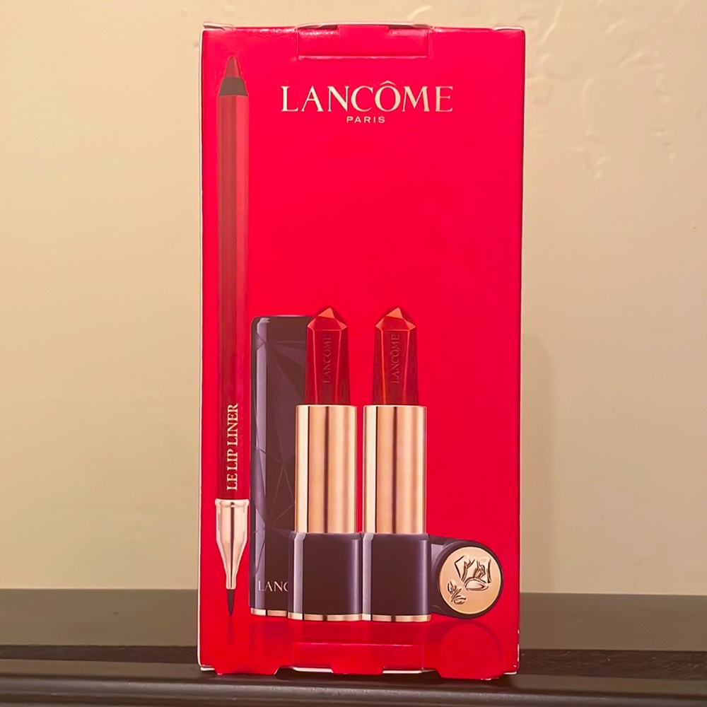 Lancôme-. (2) lipsticks, (1) lip liner.